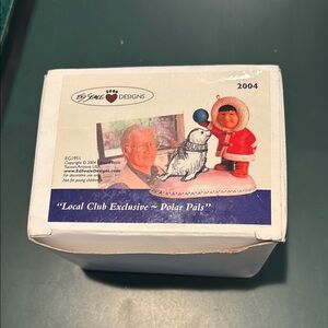 Adorable Child and Seal Figurine